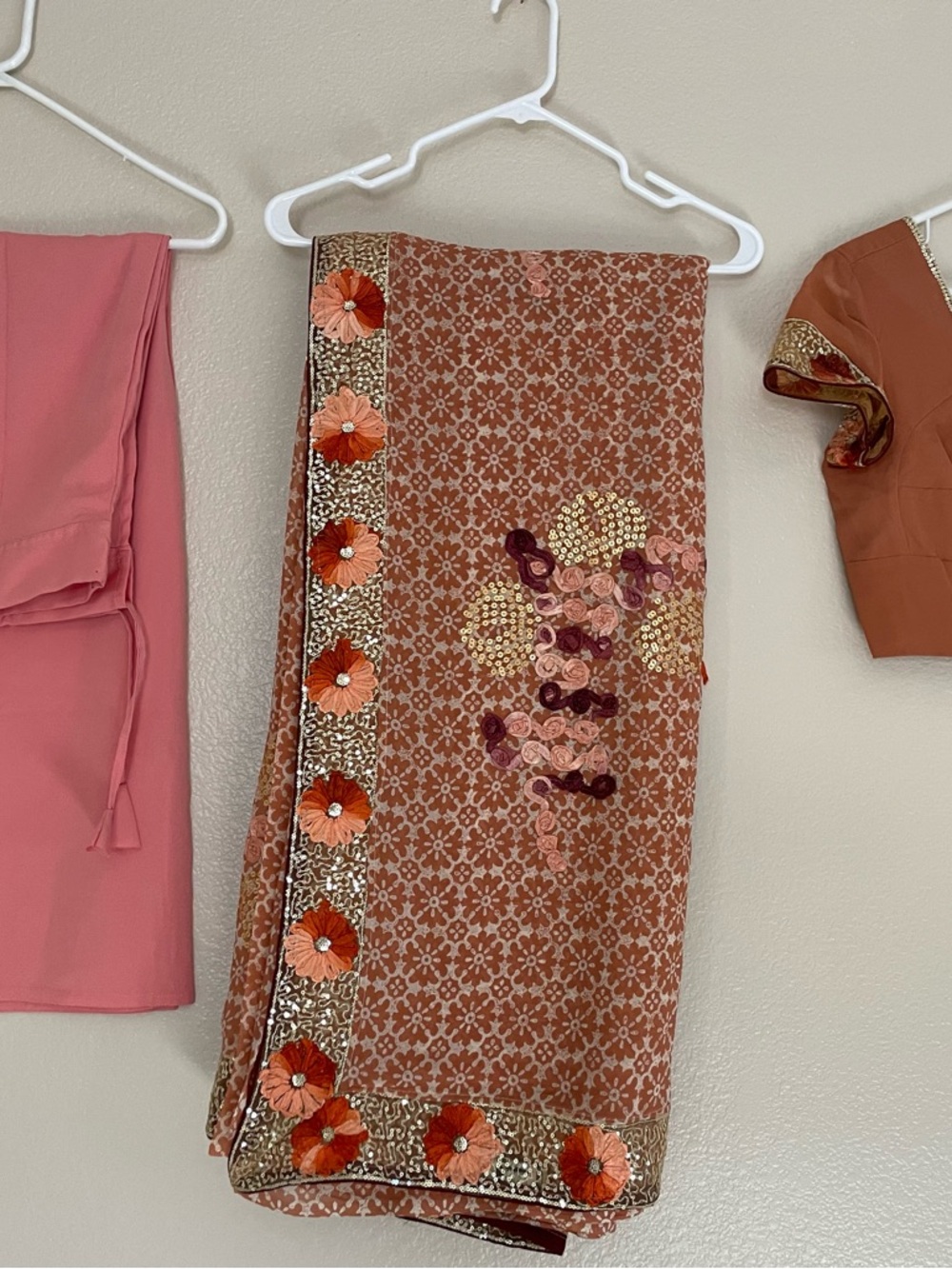 Peach embroidered sari with blouse.